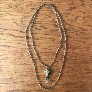 Long necklace with gold cross pendant